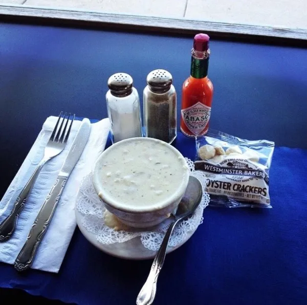 Schooners clam chowder on blue tablecloth
